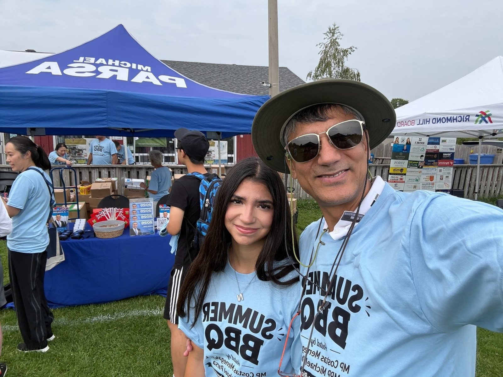 Alex Jafari volunteering at a summer community event